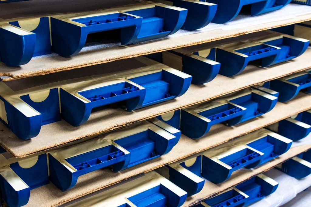 Rack of hand masked parts that we refurbish. Sanding and prep, intense hand masking, cosmetic coating, and graphics.