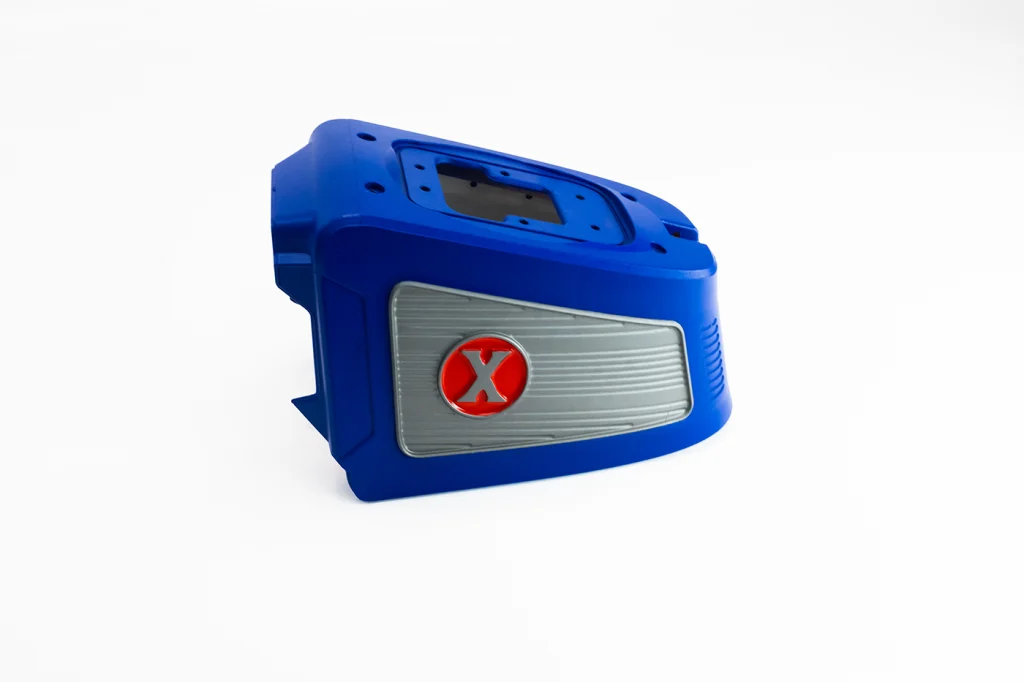 Close up of a cosmetic blue and red painted part.