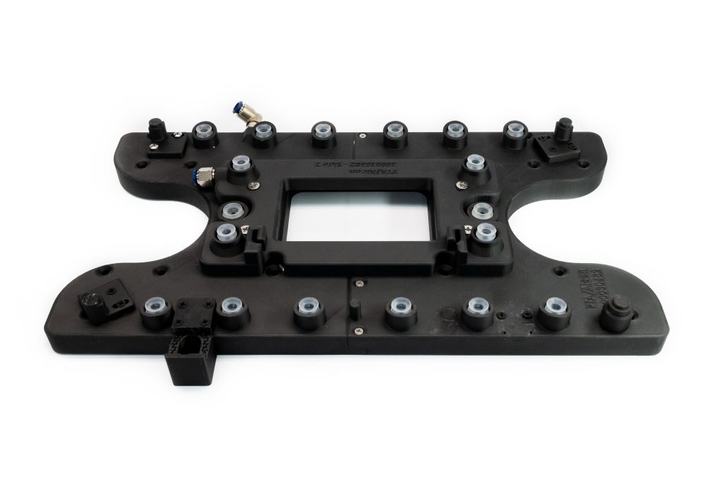 Custom 3D-printed vacuum fixture for holding parts flat during gasketing. This has hardware inserted into the 3D print and the air channels are designed to be printed inside the fixture.