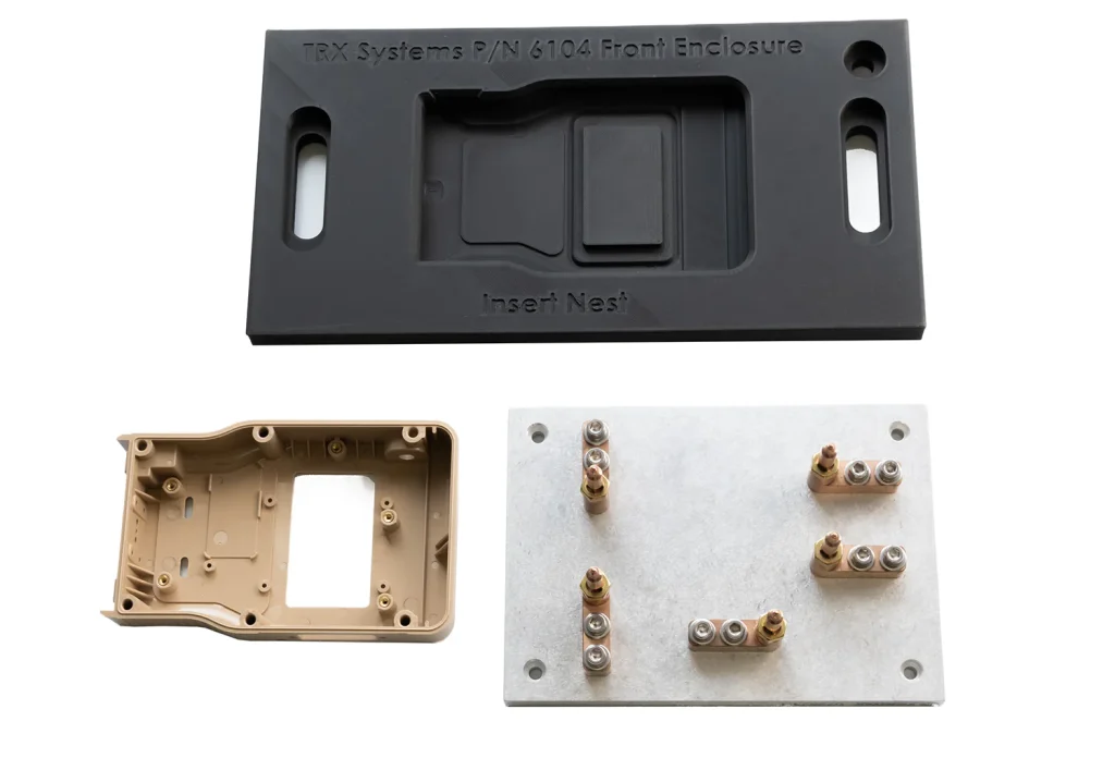  Inserted part, nesting fixture, and custom head piece for our insert machine.