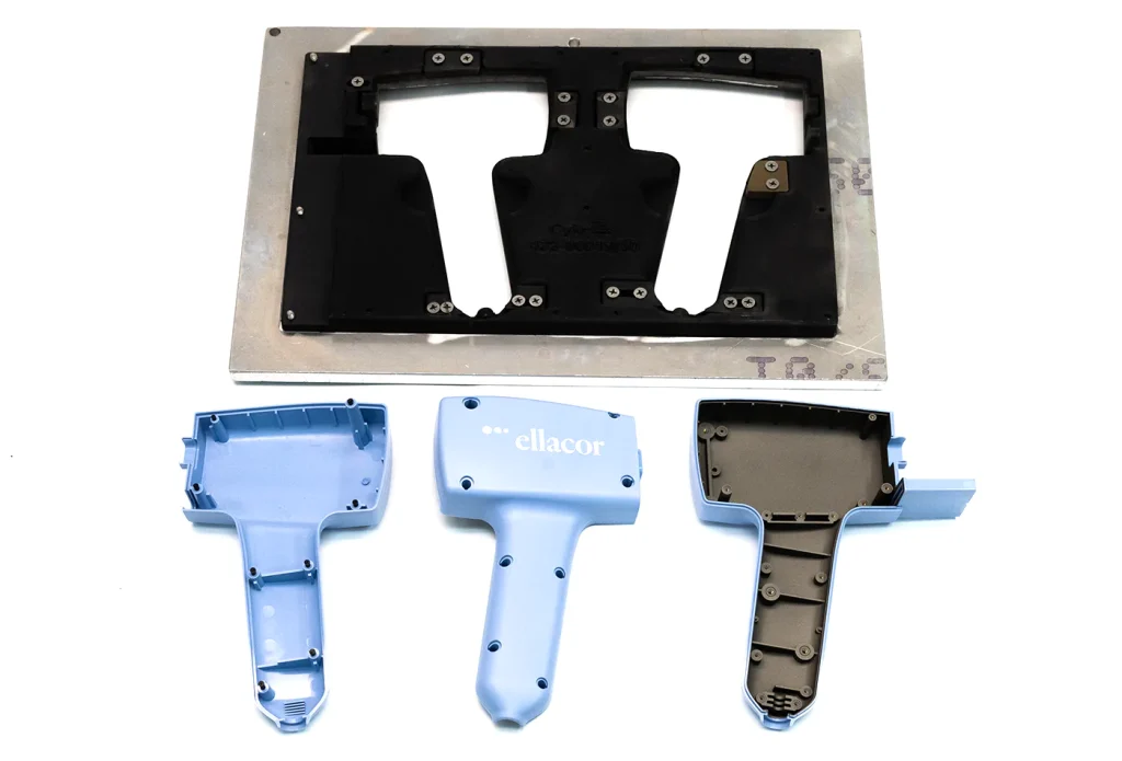 At top: a custom 3D-printed/metal hybrid masking tool. Below: physical parts, left to right: interior of raw plastic part with black plugs in insert threads; outside of raw plastic part with inkjet print applied; inside of EMI coated part using the above masking tool.